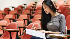 Girl in lecture theatre.